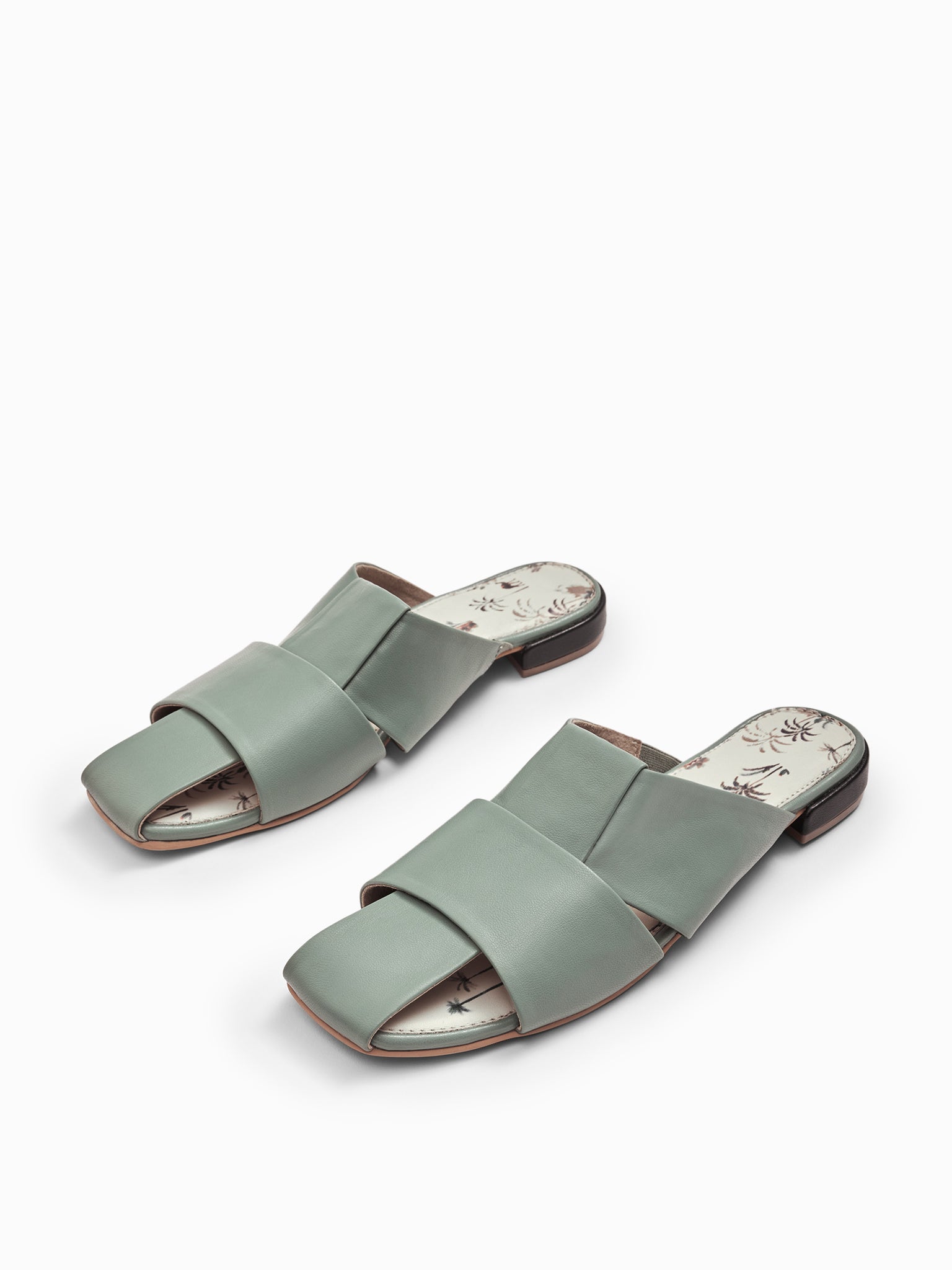 Palm Tree Print Cutout Mules
Palm Tree Print Cutout Mules