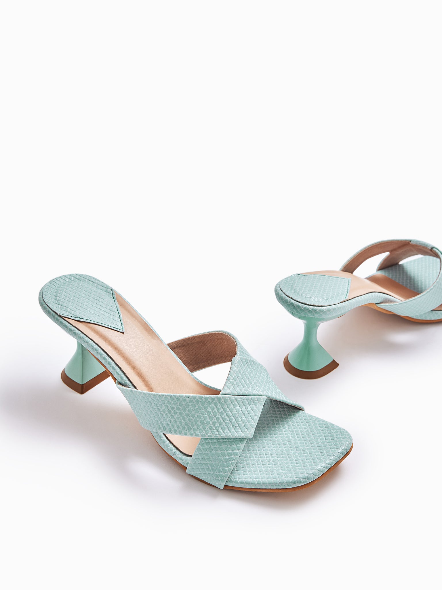 Aqua Cross Strap Spool Heels
Aqua Cross Strap Spool Heels