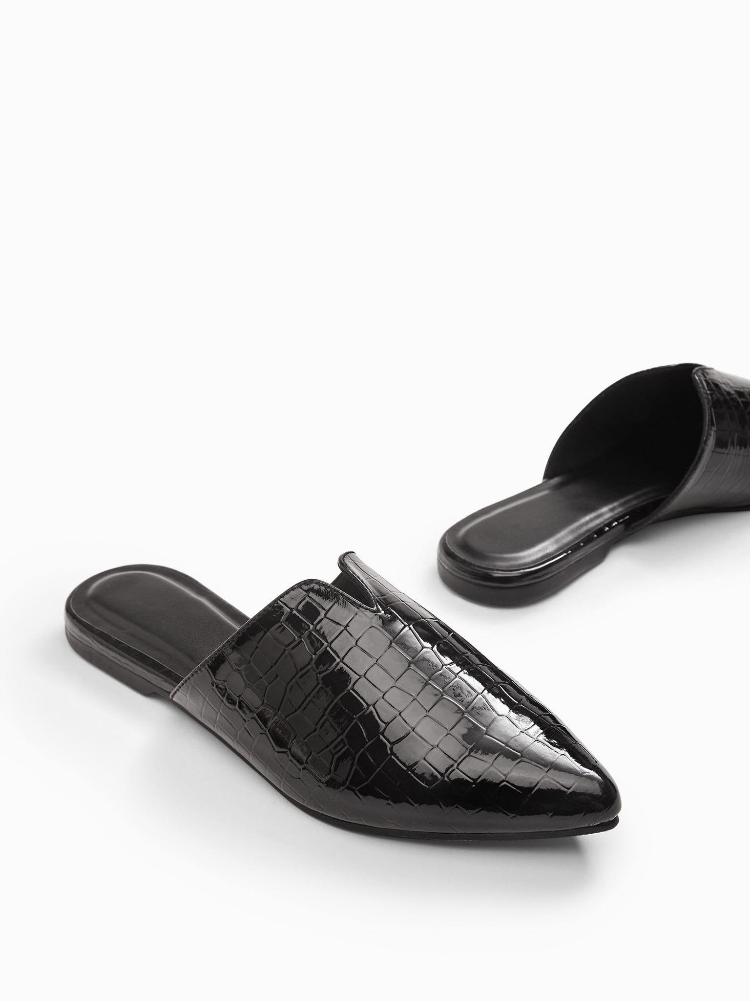 Black Textured Mules
Black Textured Mules