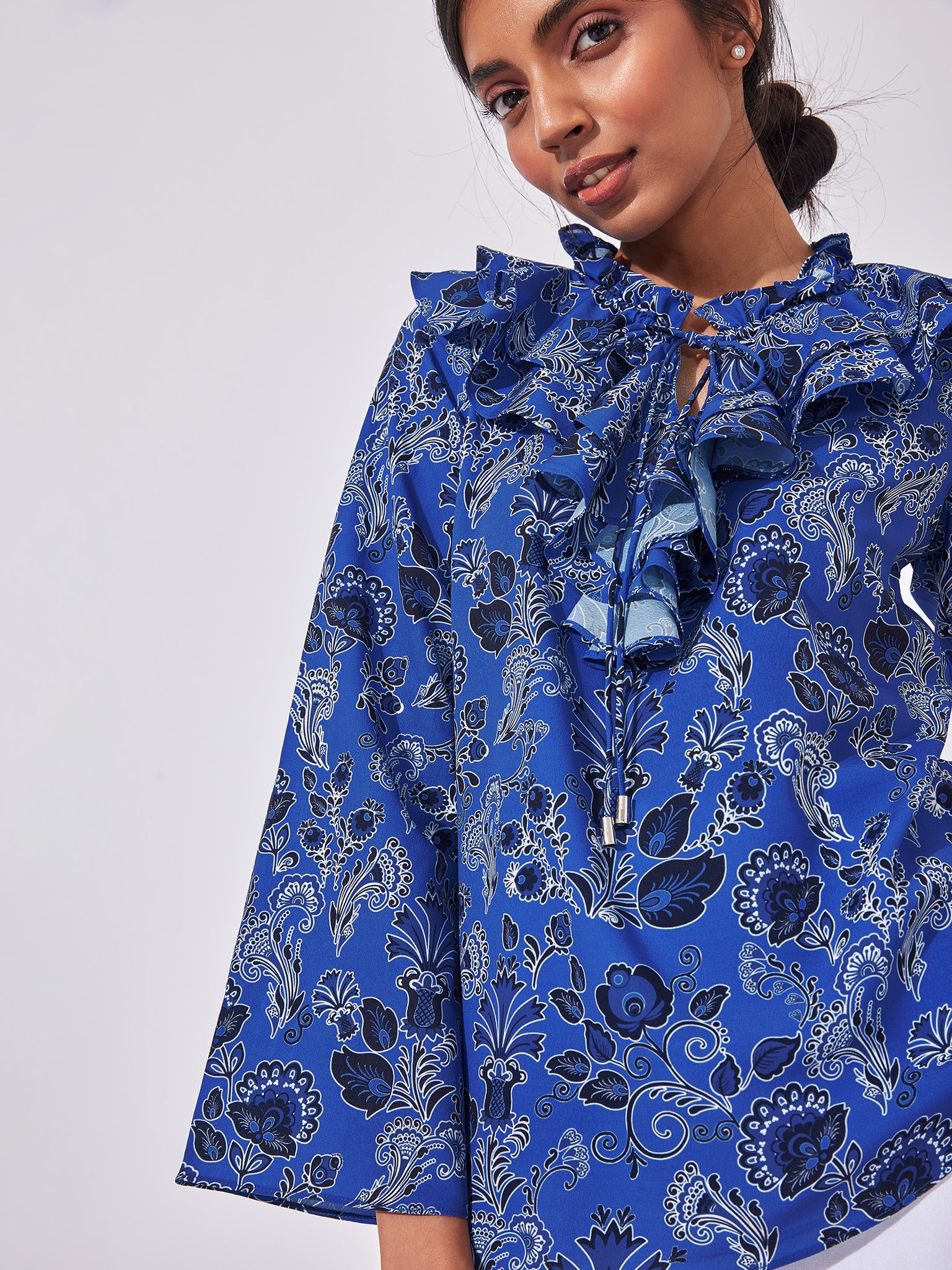 Lapis Floral Ruffle Neck Top
Lapis Floral Ruffle Neck Top